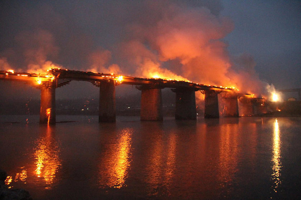 As a weird nerd, scifi is how I fit in, but never mind that. What’s important to me is ‘fitting into the world.’ I’m not an island, but many of my ‘bridges’ to everyone else have burned. Some infernos were self-inflicted, others the direct result of social arson. 

Here is a picture of a burning bridge to signify that point.

