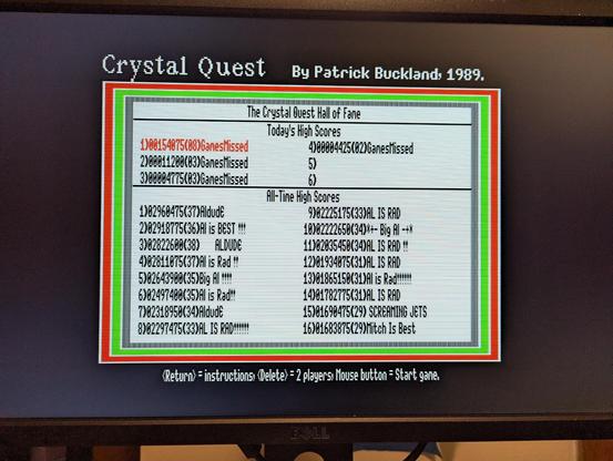 A photograph of a computer monitor displaying the high score screen for "Crystal Quest" for the Apple IIgs, from 1989.  My scores for the evening don't even come close to the "All-Time High Scores."