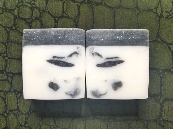 white soap with pewter-grey details and a sparkly top layer