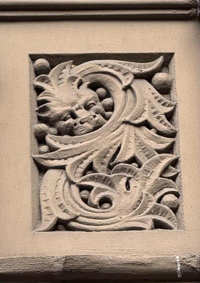 A photo of a sleeping dragon in a flourish on an Upper West Side brownstone on Manhattan. 