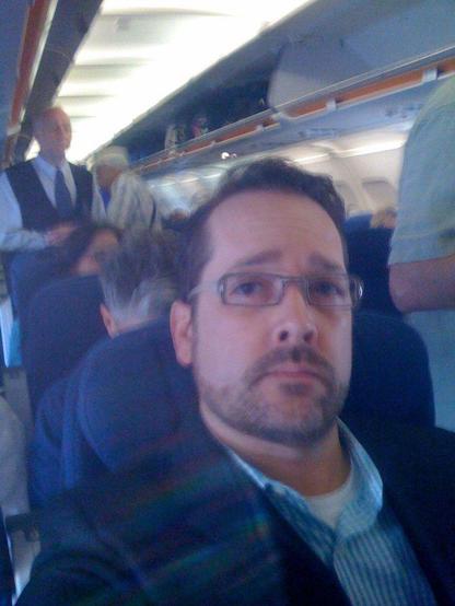 Photograph of a Stranger on Airplane airline passenger. Image attribution: flickr user davitydave - creative commons share alike 2.0 generic