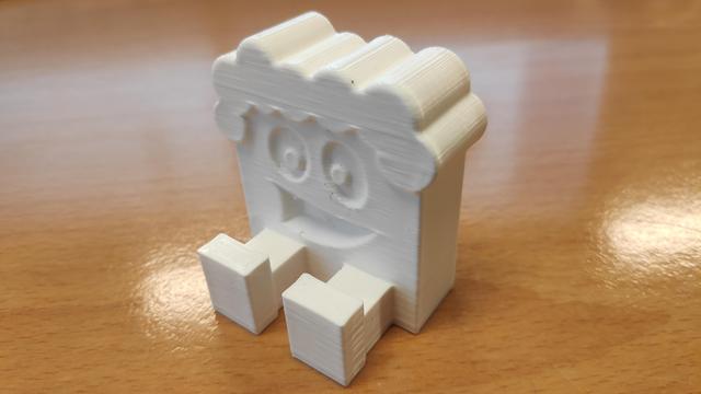 A 3d printed Freddy, big smile curly hair.