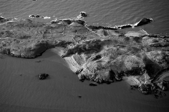 Mostly 12th century outlines of building remains at Llanddwyn island.