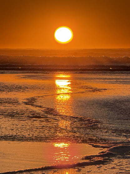 Sunset reflected on the beach. 