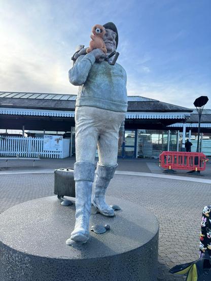 A jellycat called Dwayne Raccoon on the Skegness statue
