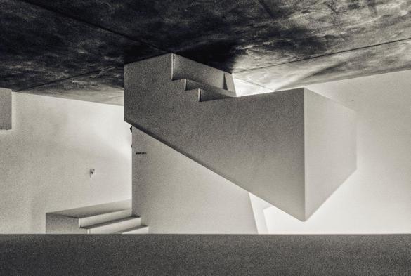 slightly disorientating monochrome photo of a stairwell