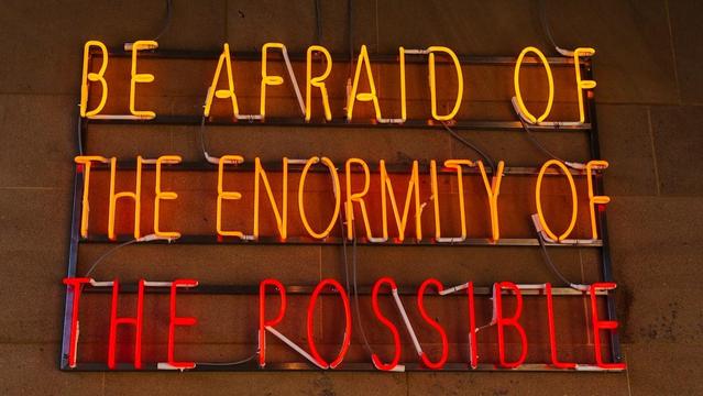 “If you look at all the other science fiction writers, they always view the world as getting to this post-apocalyptic, dystopian, horrible nightmare … Star Trek is the only universe where they said, ‘we fixed it, we solved it’ … [Star Trek] is the only one that has hope.”

Picture is of a neon sign that says "Be afraid of the enormity of the possible."