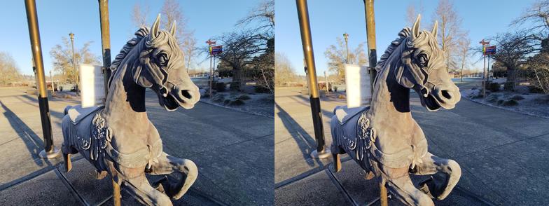 A stereoscopic view, day, outdoors, of a brass carousel horse covered in a thin layer of frost.