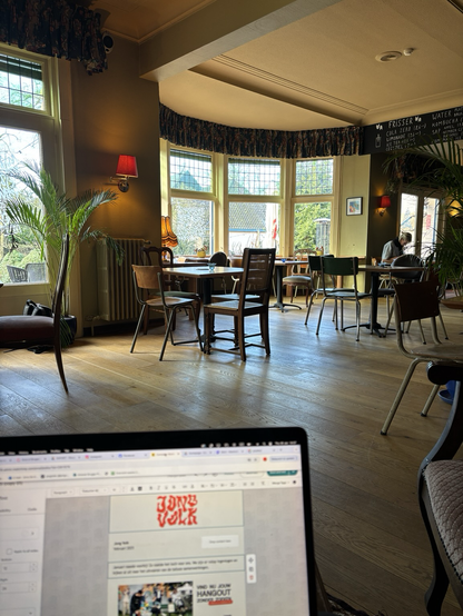 A bar set in a quiet, home-like interior. A laptop screen is visible on the bottom of the picture