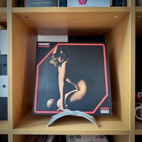 Vinyl of “Dreamin’ Geronimo” by Gianni Oddi displaying a naked person with long hair cast in shadows