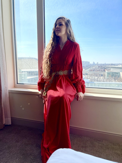 A princess Buttercup cosplayer sitting on a windowsill