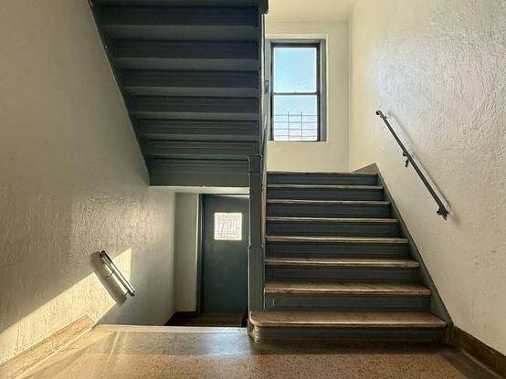 A New York stairwell, lit by early morning sun.