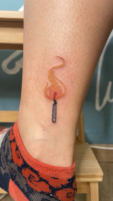Tattoo of a match