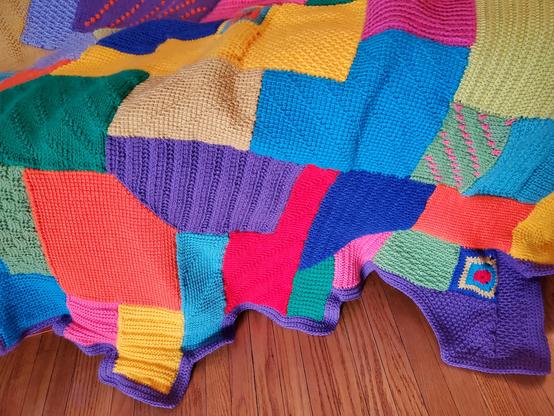 Close-up of stitches, shapes and colours on a wacky crocheted afghan