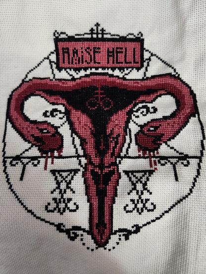 Counted cross-stitch project: "Raise he'll for reproductive rights" designed by The Witchy Stitcher
A uterus in a pentagram, fallopian tubes ending with snake heads dripping blood