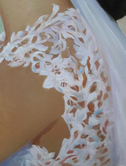 a close-up of her shoulder, the dress is a floral design 