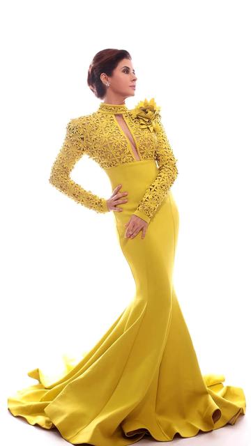 Urmila Matondkar lights up the fashion world in a stunning sunshine yellow designer gown that’s a perfect blend of elegance and glamour. Featuring a one-shoulder design with intricate floral appliqué and dazzling rhinestones, this ensemble is a true masterpiece. Paired with diamond jewellery and a sleek updo, her red carpet look is nothing short of perfection.