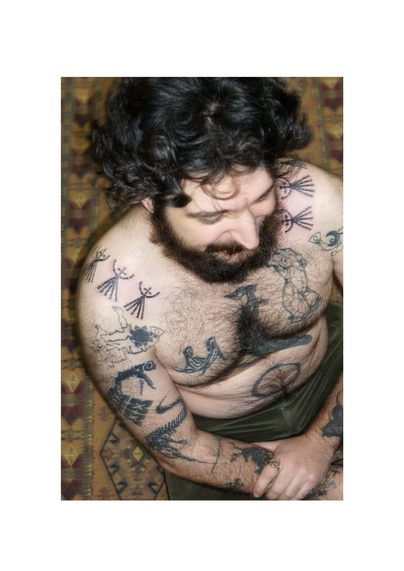 Tattooed patterns on the shoulders done in Lyon