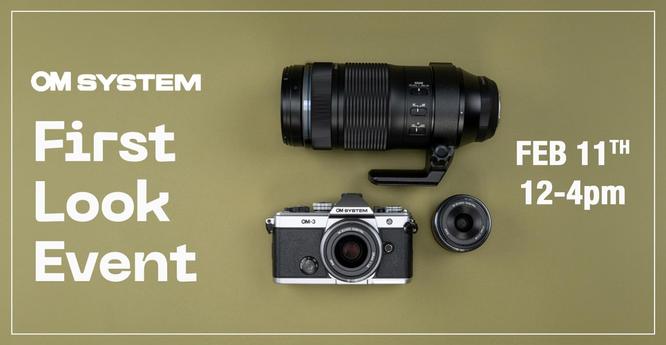 Promotional graphic for the OM SYSTEM 'First Look Event' featuring a top-down view of an OM-3 camera, a large telephoto lens with a tripod collar, and a smaller prime lens, all placed on a muted green background. The event details, 'FEB 11TH 12-4pm,' are displayed in bold white text on the right side, while the OM SYSTEM logo and 'First Look Event' are on the left.