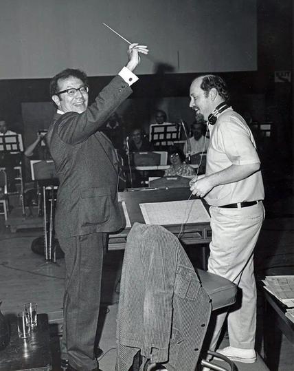Before he hit the big time, John Williams was Johnny Williams, and he composed the theme tunes for Lost in Space, The Time Tunnel and Land of the Giants. Here he is letting the creator of those series, Irwin Allen, play with his baton (I suspect there's a crude joke there, but I'm really not the sort of chap to make it).