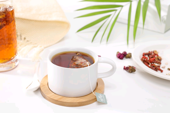 A mug with a teabag in it.