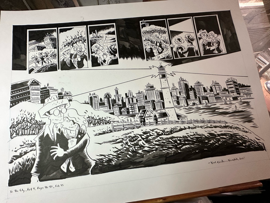 An inked two page comic book spread sitting on a drawing table: a couple looks over a lighthouse, bay, and lit up cityscape late at night. 