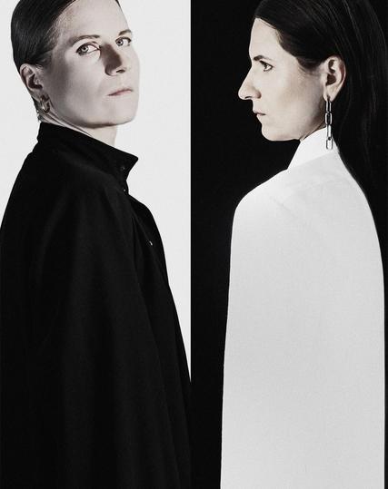 Self-portrait featuring both sides with contrasting black and white clothing and image desaturation,  for black and white photography aesthetic. 