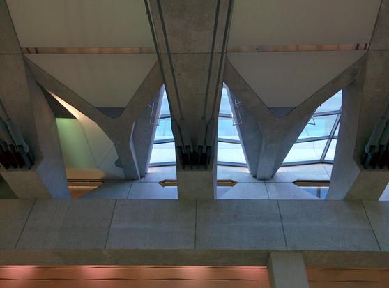 Image: Looking up at concrete buttresses spanning the rail station linking terminals at Dulles in Washington, D.C.