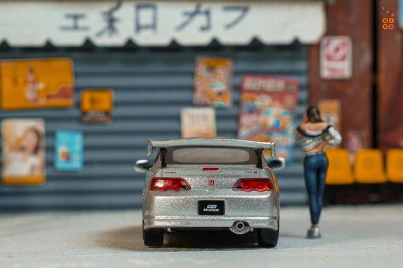 A rear side of Honda Integra Type R DC5 Mugen, Silver by Tarmac Works in 1:64 scale with 1:64 figure on AREA 164