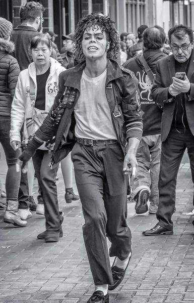 Michael Jackson impersonator dancing on Market Street in San Francisco.