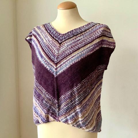 A knit tee in purples, it's shown on a mannequin against a white background.