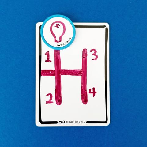 An InfiniTokens dry erase token with a gear shift drawn on it with the positions labeled from 1-4. A dry erase counter (disc) with a gear stick drawn on it sits in the '1' position.