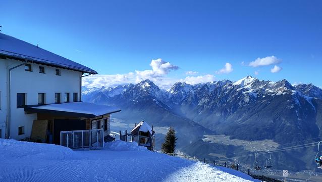 View over the Karwendel - snowy alps, cottage in front
