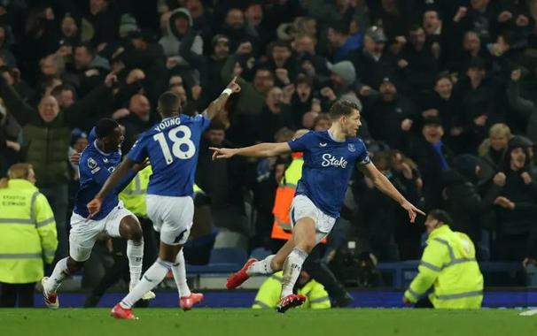 James Tarkowski, wheeling away in celebration after scoring the equalizer deep into stoppage in the last derby at Goodison Park.