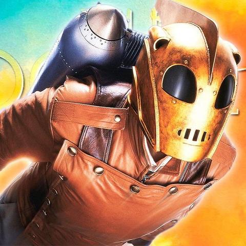 Promo image for the movie "The Rocketeer," showing the main character flying through the air, facing right and toward the camera.

He is wearing a golden helmet with an Art Deco look, a reddish leather jacket, and has a rocket pack strapped to his back.