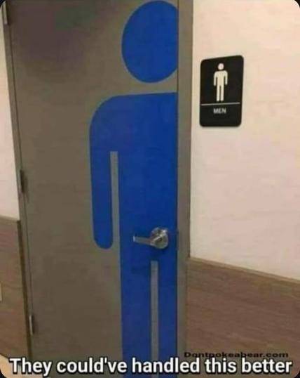 A bathroom door with a large blue “man” from the international symbology for bathrooms on the door next to a sign indicating that it is for men. The door handle is located in a sensitive location.

Across the bottom of the image it says, “They could have handled this better.”