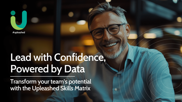 A smiling team manager in a professional office setting, symbolising confidence and success from using a skills matrix to manage team capabilities with accurate data.