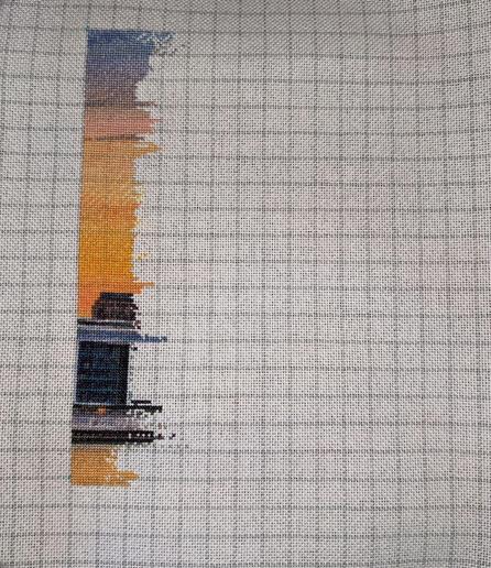 A portion of a cross stitch showing the Chicago Skyline. 