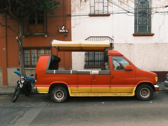 Open roof red yellow striped van