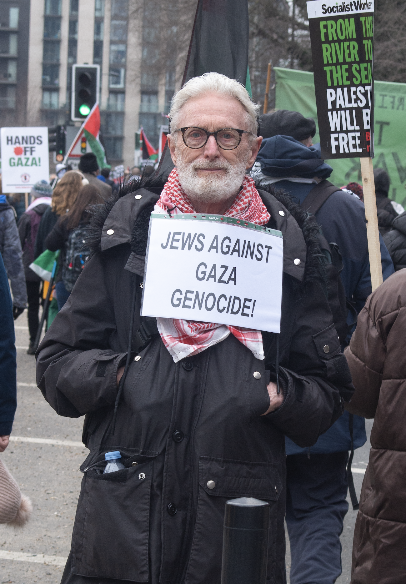 Stephen was surprisingly fluent in French. He was happy me taking a portrait of him carrying the sign 'Jews against Gaza genocide'