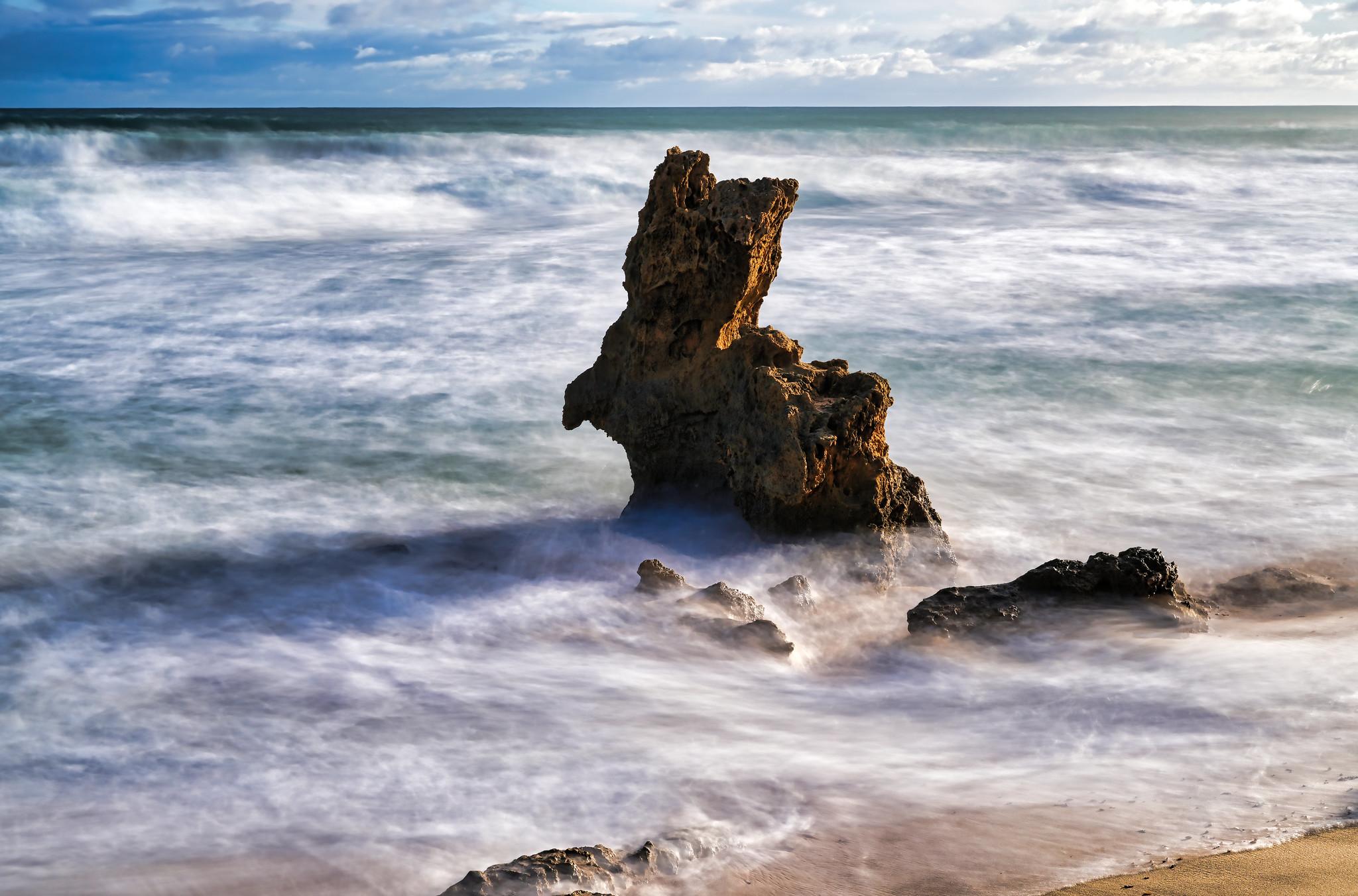 Montfort Beach offers a hidden gem known as Rabbit Rock (or Bunny Rock). This charming geological formation resembles a giant rabbit and is a delightful sight for visitors exploring the area.

Location & Access Rabbit Rock is located near Blairgowrie, Victoria. To reach it, start at the beach access carpark at the end of Hughes Road. Follow the Coppins Track and Dogs Head Track, which will lead you out to Montfort Beach. From there, you'll find Rabbit Rock along the sandy shoreline.

The Walk The Rabbit Rock Circuit is a moderately challenging 3.2-mile loop trail. It's perfect for birding, hiking, and running. The trail is open year-round and offers beautiful coastal views. Keep an eye on the tide times, as some sections of the trail can be inaccessible during high tide.
