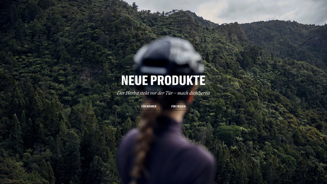 Ein Screenshot des Banners der aktuellen Homepage von rapha.com.

Zu sehen ist eine unscharfe Fahrradfahrerin von hinten die auf einen Wald schaut.  Darauf liegt der Text als Überschrift "NEUE PRODUKTE" und darunter steht kleiner: "Der Herbst steht vor der Tür – mach dich bereit".
Darnter befinden sich zwei Buttons mit den Texten "Für Männer" und "Für Frauen".