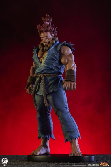 a photo of akuma, seen from the right side, neon red flame clouds behind him 