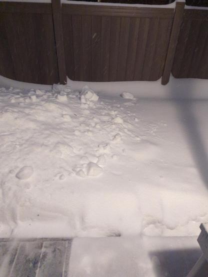View from back door, were snow is going a few inches above a 2 foot porch