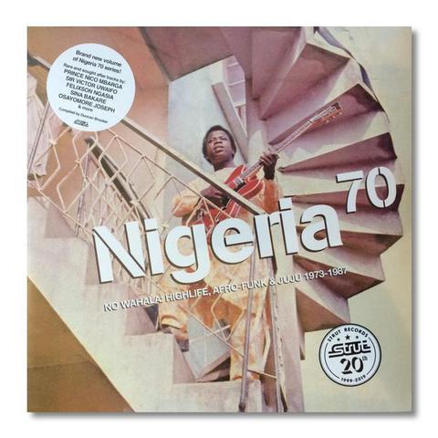 The album cover for Nigeria 70: No Wahala: Highlife, Afro-Funk & Juju 1973-1987 features a vibrant and colorful design. It showcases a collage of vintage photographs and illustrations, reflecting the rich musical heritage of Nigeria during that era. The title is prominently displayed in bold, stylized lettering, capturing the energetic and diverse spirit of the compilation.