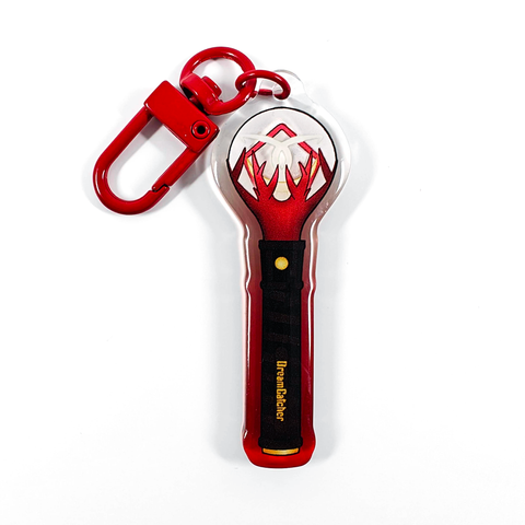 A picture of an acrylic keychain of a drawn version of Dreamcatcher's newest lightstick. The rim of the keychain has an ombre that goes from red at the bottom to clear at the top. It has a red clasp.
