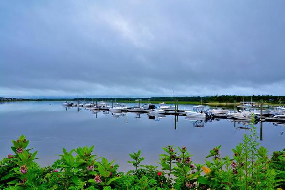 An August Morning

Boats are docked peacefully at Wells Harbor in Maine. It is a cloudy sky in the early morning hours, but the forecast for the day is hot and humid with the skies clearing by noon. It won't be long before the boaters are out and about and enjoying a day on the water.