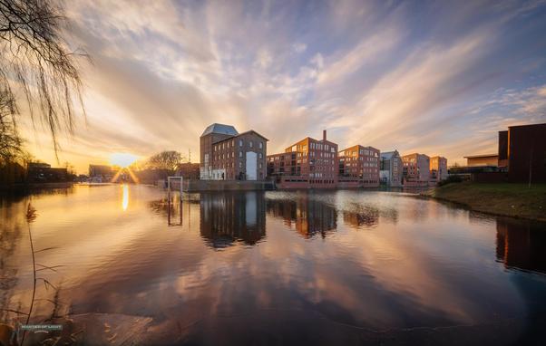Wonderful cityscape in Deventer with X shaped cloudscape
