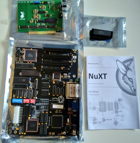 **TL;DR:** A NuXT Turbo XT motherboard, an AdLib sound card, a chip, and a user manual are displayed, all in protective packaging.  

This image showcases retro computing hardware, including a Monotech NuXT Turbo XT motherboard, a modern XT-class motherboard designed for vintage computing enthusiasts. Alongside it is an AdLib sound card from 1990, known for its FM synthesis audio in early PC gaming. There's also a smaller chip in an anti-static bag and a printed user manual for the NuXT. The components are laid out neatly on a table, highlighting the excitement of a retro computing enthusiast receiving their new gear.