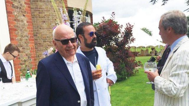 Nigel Farage (Right, Far Right) speaks to Rupert Murdoch and Lord Lebedev of Putin at a garden party. 